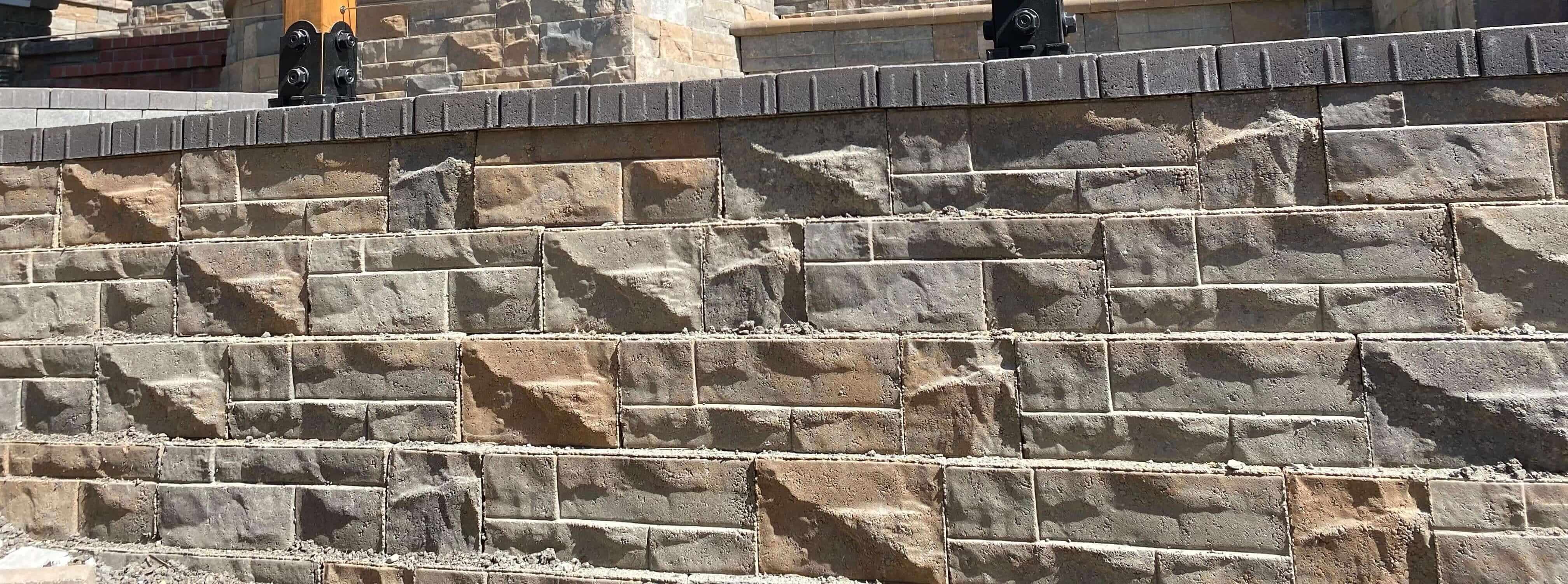 Terraced retaining wall system